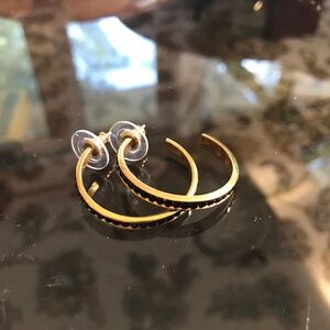 Pair of gold  tone earrings with black stones hoop earring.